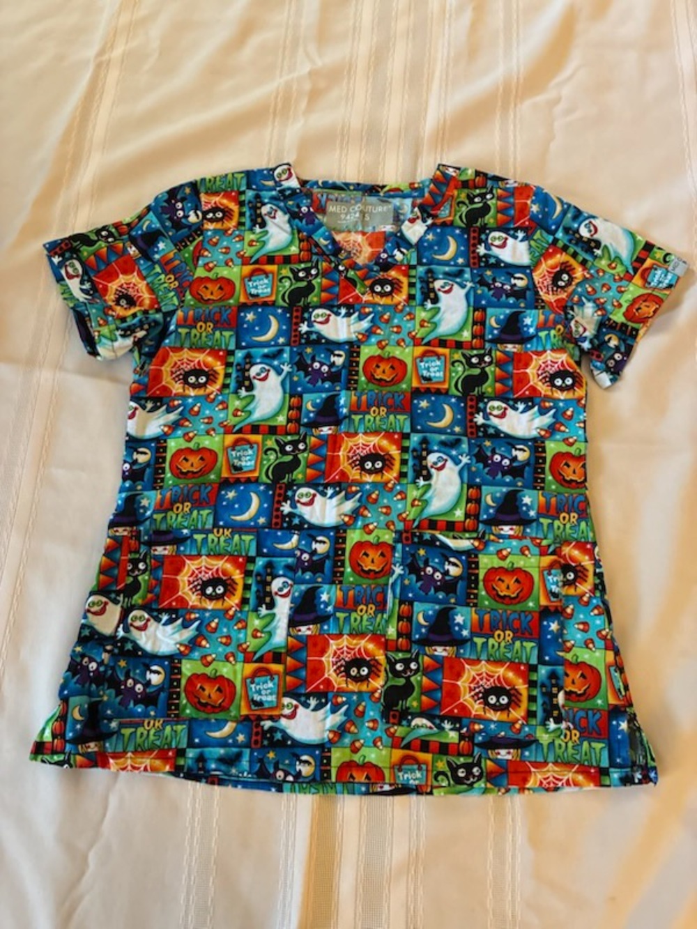 Med Couture Women’s Halloween Cartoon Patchwork Scrub Top - Blue, Green, Orange